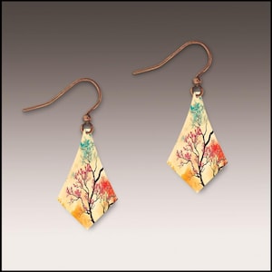 May include: A pair of copper-colored earrings with a diamond shape. Each earring features a painted tree design with red, pink, orange, and blue leaves. The earrings have a hook closure.