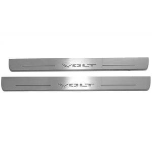 May include: Two brushed metal car door sill protectors. Each has the word "VOLT" etched into the surface. The protectors are rectangular with rounded ends and a single horizontal groove.