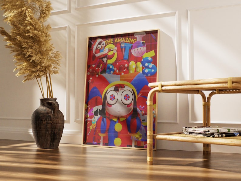 May include: A framed art print featuring a cartoon character with large eyes, wearing a colorful jester-like outfit. The artwork has a red background with the words "THE AMAZING" at the top. The print is displayed near a decorative vase and a woven side table.