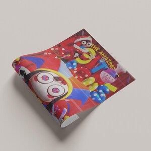 May include: A red and multi-colored print with the text "THE AMAZING". The print features cartoon characters and various colorful shapes, including polka dots and a chef's hat.