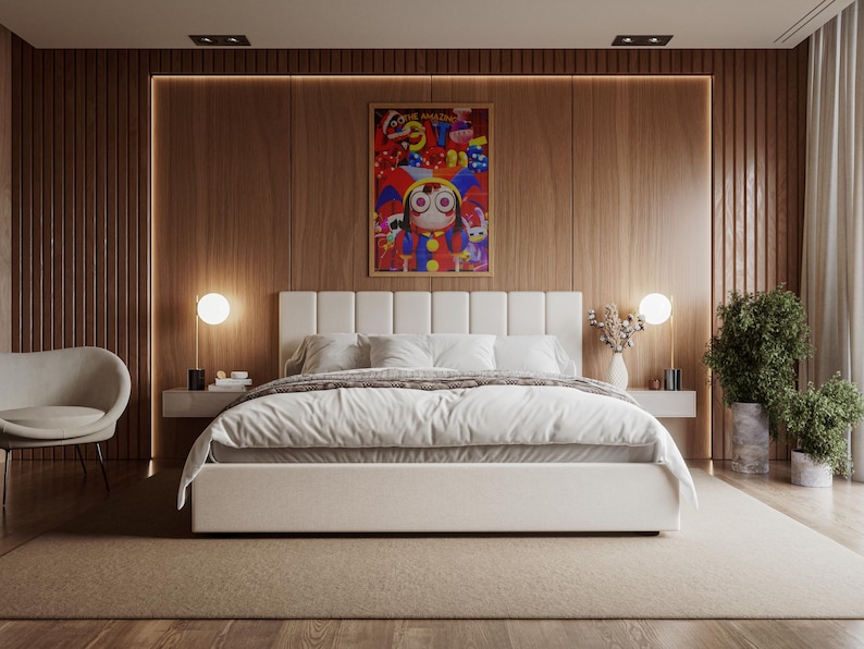 May include: A modern bedroom with a large white bed, a colorful framed artwork, and wooden paneling. The room features a neutral color palette with accents of green from potted plants. Two bedside tables with lamps flank the bed.