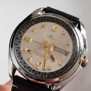 Sicura by Breitling Automatic cal BF 158  Date 38 mm Circa working good