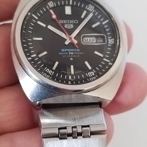 Reloj automático vintage SEIKO 5 Sports 6119-6023 para hombre, esfera negra, rotación del bisel en buen estado, producto de 1970.