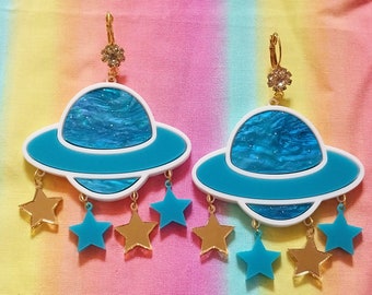 Colorful Acrylic SATURN and STAR Earrings in detailed blue, white, gold, and teal charms ; Laser Cut Jewelry