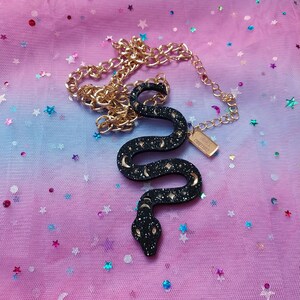 Long Glittery Black Acrylic Snake Pendant Necklace with Witchy Gold Details and Gold Chain