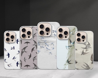 May include: Five phone cases with bird designs. The cases feature various patterns of swallows in flight, with colors including white, gray, and blue. The cases are displayed on a white surface.