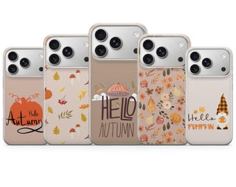 May include: Five smartphone cases featuring autumn-themed designs. The cases display illustrations of pumpkins, mushrooms, leaves, an umbrella, and a gnome, with text including Hello Autumn and Hello Pumpkin in various fonts and warm color palettes.
