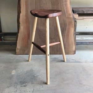 Stool made in sustainably sourced black walnut.