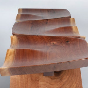 Walnut stools made in natural edge wide plank walnut.