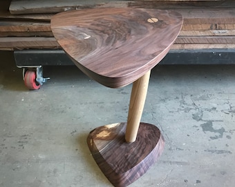 Triangular cantilevered side table in walnut