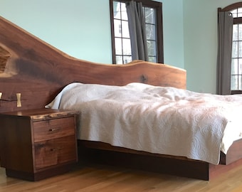 Natural edge walnut bed set with solid bronze accents.