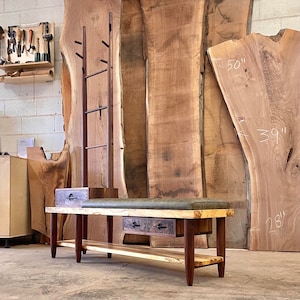 Entry bench with coat hanging and shoe storage.