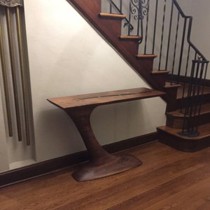 Sculpted cantilever walnut hall table