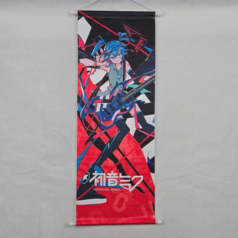May include: A vertical wall scroll featuring a vibrant anime-style illustration. The artwork showcases a character with blue hair and a guitar against a backdrop of red, black, and white geometric shapes. The text "Hatsune Miku" is visible.