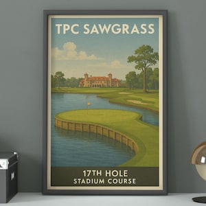May include: Framed vintage-style print of the TPC Sawgrass golf course's 17th hole. The artwork features a green golf course surrounded by water, with a building in the background. The text "TPC Sawgrass" and "17th Hole Stadium Course" are displayed.