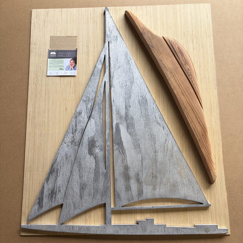 distressed silver sail with wooden hull