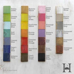 May include: A color palette display featuring wooden blocks painted in various shades. Colors include Patina Green, Historic Yellow, Sweet Heart Pink, and Oyster White. Each block is labeled with its color name, offering a visual guide for design inspiration.