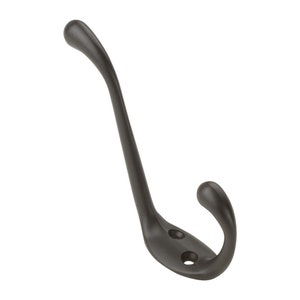May include: A black metal hook with a curved design. The hook has two small holes near the base.