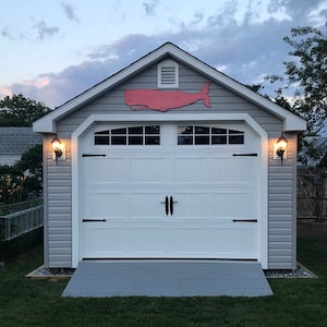 Example of out Folk Whale in Pink displayed outdoors over a garage. Super-Cute