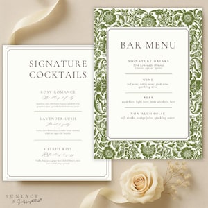 May include: Two elegant wedding signs. One reads "Signature Cocktails" with drink descriptions. The other is a "Bar Menu" with drink categories. Both have a white background with a green floral border and text.