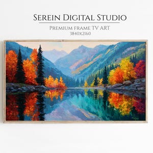 May include: A framed landscape painting depicts a serene mountain scene with a lake reflecting the colorful autumn foliage. The artwork features vibrant hues of orange, yellow, and red trees, contrasted by the deep blues and greens of the mountains and water. The text "SEREIN DIGITAL STUDIO" is at the top.