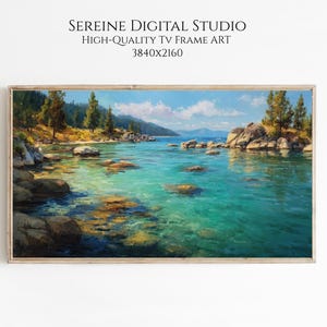 May include: A framed landscape painting of a serene lake scene. The artwork features clear turquoise water, rocky shores, and distant mountains under a blue sky with fluffy clouds. The text "SEREINE DIGITAL STUDIO HIGH-QUALITY TV FRAME ART 3840x2160" is at the top.