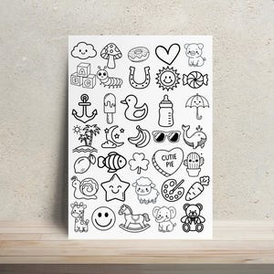 May include: A white rectangular sheet featuring a grid of black and white line art illustrations including a cloud, mushroom, doughnut, heart, pig, alphabet blocks, caterpillar, horseshoe, sun, sweet, anchor, ice lolly, duck, bottle, umbrella, palm trees, moon, bananas, sunglasses, whale, lemon, fish, clover, heart with text CUTIE PIE, cactus, snail, star, sheep, paint palette, carrot, giraffe, smiley face, rocking horse, elephant, and teddy bear.