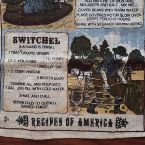May include: A vintage-style kitchen towel featuring a recipe for "Switchal" (Haymakers Drink). The recipe includes ingredients such as ground ginger, honey, molasses, cider vinegar, and eggs. The towel depicts a colourful illustration of a man working in a field with a cart and a glass of the drink.