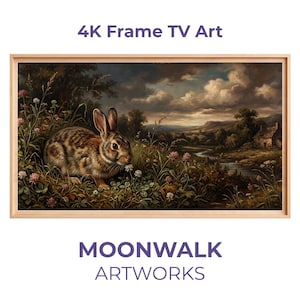 Puede incluir: Una impresión artística enmarcada para TV 4K que presenta una pintura detallada de un conejo en un campo de flores, con un fondo de paisaje. La obra de arte está enmarcada en un marco de madera clara. Se muestra el texto "4K Frame TV Art" y "MOONWALK ARTWORKS".