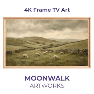 Pode incluir: Pintura de paisagem emoldurada com ovelhas pastando em um campo verde. A obra de arte, rotulada como "4K Frame TV Art" e "Moonwalk Artworks", retrata colinas onduladas, muros de pedra e um céu nublado, tudo dentro de uma moldura de madeira clara.