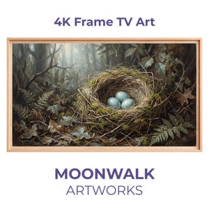 Puede incluir: Una obra de arte enmarcada para un televisor 4K Frame. La imagen muestra un nido de pájaros con tres huevos azules en un entorno forestal. La obra de arte está en un marco marrón claro. Se muestra el texto "4K Frame TV Art" y "MOONWALK ARTWORKS".
