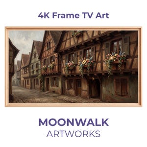 Puede incluir: Una obra de arte digital enmarcada para un televisor 4K. La imagen representa una escena de calle de un pueblo europeo con edificios de entramado de madera, jardineras y calles empedradas. La obra de arte está en un marco de madera clara. El texto "4K Frame TV Art" y "MOONWALK ARTWORKS" son visibles.