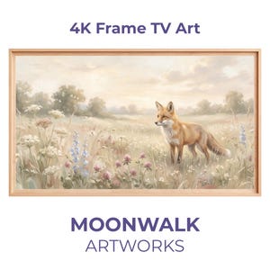 Puede incluir: Pintura de paisaje enmarcada con un zorro en un campo de flores silvestres. La obra de arte tiene un marco de madera clara. El texto "4K Frame TV Art" y "MOONWALK ARTWORKS" se muestran arriba y abajo.