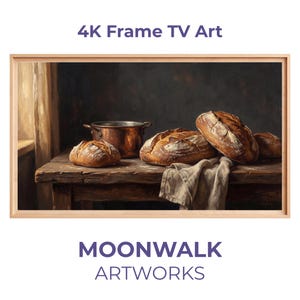 Puede incluir: Una obra de arte digital enmarcada para un televisor 4K. La imagen representa una naturaleza muerta con hogazas de pan rústico, una olla de cobre y un paño de lino sobre una mesa de madera. La obra está enmarcada en madera clara. Se muestra el texto "4K Frame TV Art" y "MOONWALK ARTWORKS".