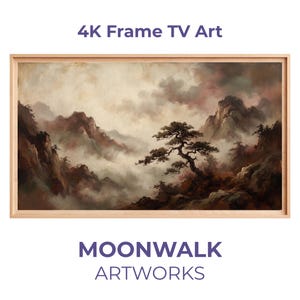 Puede incluir: Pintura de paisaje enmarcada con un marco de madera clara. La obra representa una escena de montaña con un árbol en primer plano y un cielo nublado. Se muestra el texto "4K Frame TV Art" y "MOONWALK ARTWORKS".