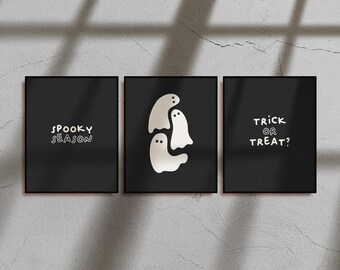 May include: Three framed black art prints with white text and ghost illustrations. The left print says "Spooky Season", the center print has three ghost figures, and the right print says "Trick or Treat?".