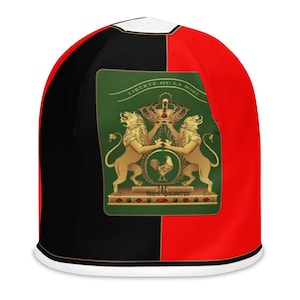May include: A beanie hat with a split design of black and red. The front features a green emblem with gold lions, a crown, and the text "LIBERTE OU LA MORT". The hat has a white trim.