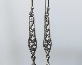 Pendientes colgantes de plata de ley con diseño de volutas de Silpada