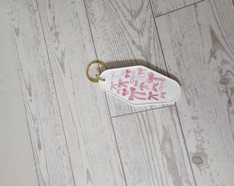 Roze strik | Motelsleutelhanger | Witte sleutelhanger