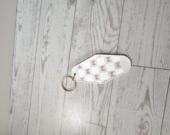 Roze strik geruite motelsleutelhanger