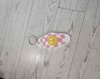 Geruit smileygezicht | Motelsleutelhanger | Witte sleutelhanger