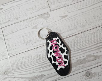 Roze 'Howdy' koeienprint | Motelsleutelhanger | Zwarte sleutelhanger