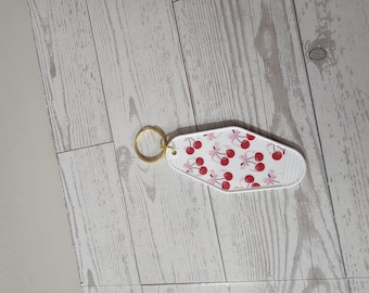 Roze strikkersen | Motelsleutelhanger | Witte sleutelhanger