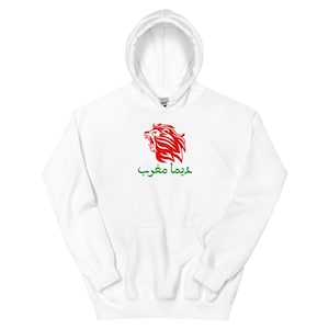 May include: White hooded sweatshirt featuring a red lion graphic and Arabic text. The lion graphic is centered on the chest, with the text below it in green. The sweatshirt has a drawstring hood and a kangaroo pocket.