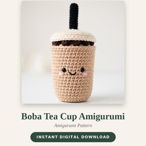 May include: A crochet amigurumi boba tea cup with a tan body, cream-coloured lid, and a black straw. The cup features a stitched face with black eyes, a small smile, and pink cheeks. Text reads WASIWORKS, Boba Tea Cup Amigurumi, and 10 cm tall.