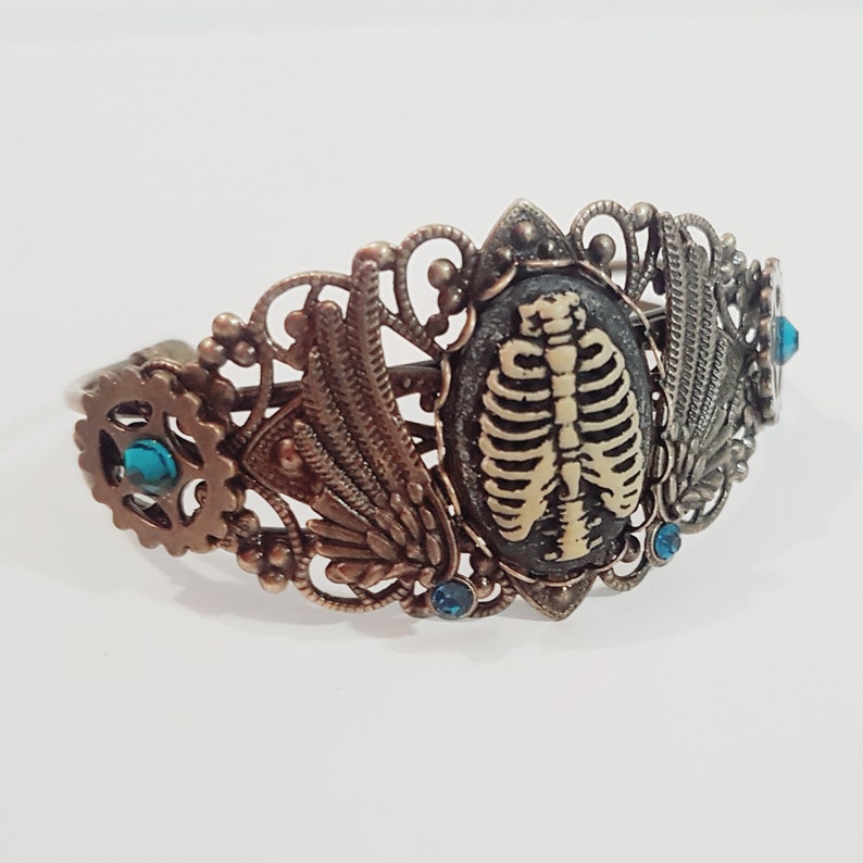 Download Prime Rib Gothic Steampunk gears wings and rib cage bronze ...