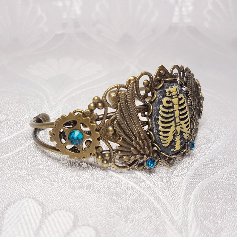 Download Prime Rib Gothic Steampunk gears wings and rib cage bronze ...