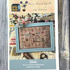 May include: A cross stitch pattern chart for a design titled "Stitch". The chart is part of a series called "Words to Stitch By". The design features a blue house with a red roof and a flower pot with purple flowers. The chart is designed by Lori Pengelly.