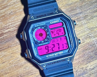 Barbie - Casio Royale (AE-1200) roze mod met zilveren kast, wereldtijd