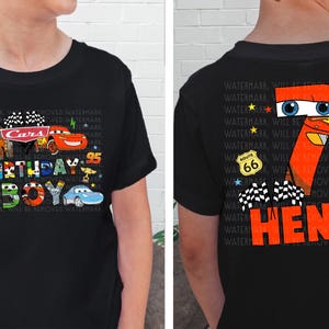 a young boy wearing a black shirt with a cartoon character on it